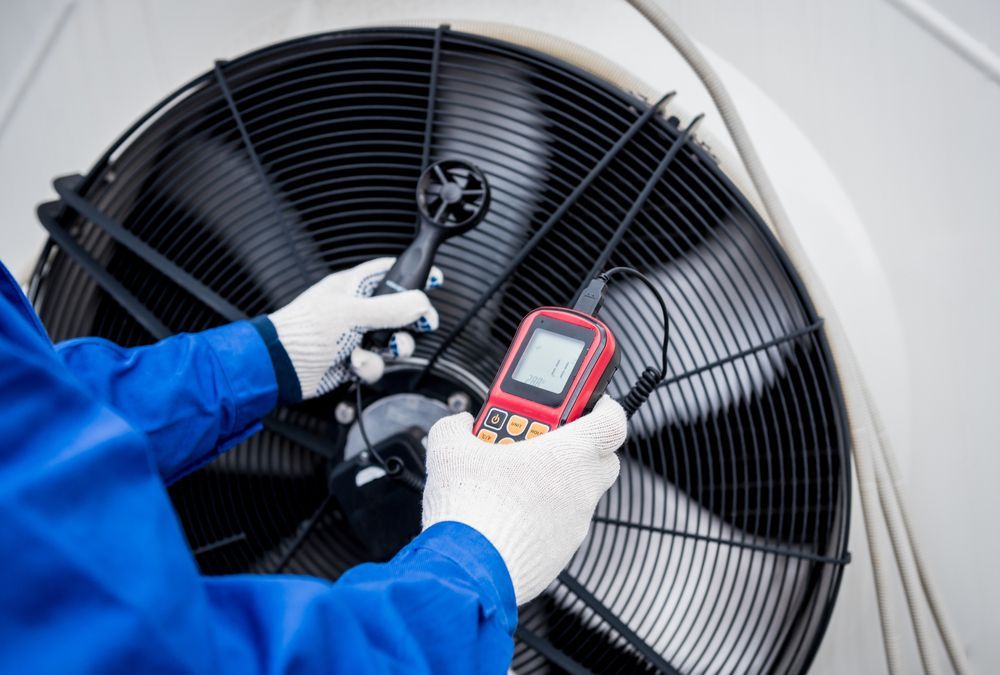 HVAC technician testing a unit