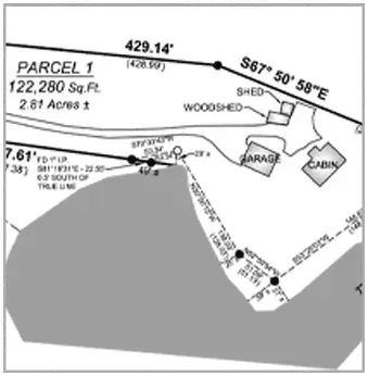 A black and white land survey map showing parcel boundaries, structures like a garage and cabin, and area measurements.