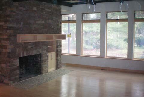 Fireplaece With Empty Living Room — Freehold, NJ — Zimbler Architecture, LLC