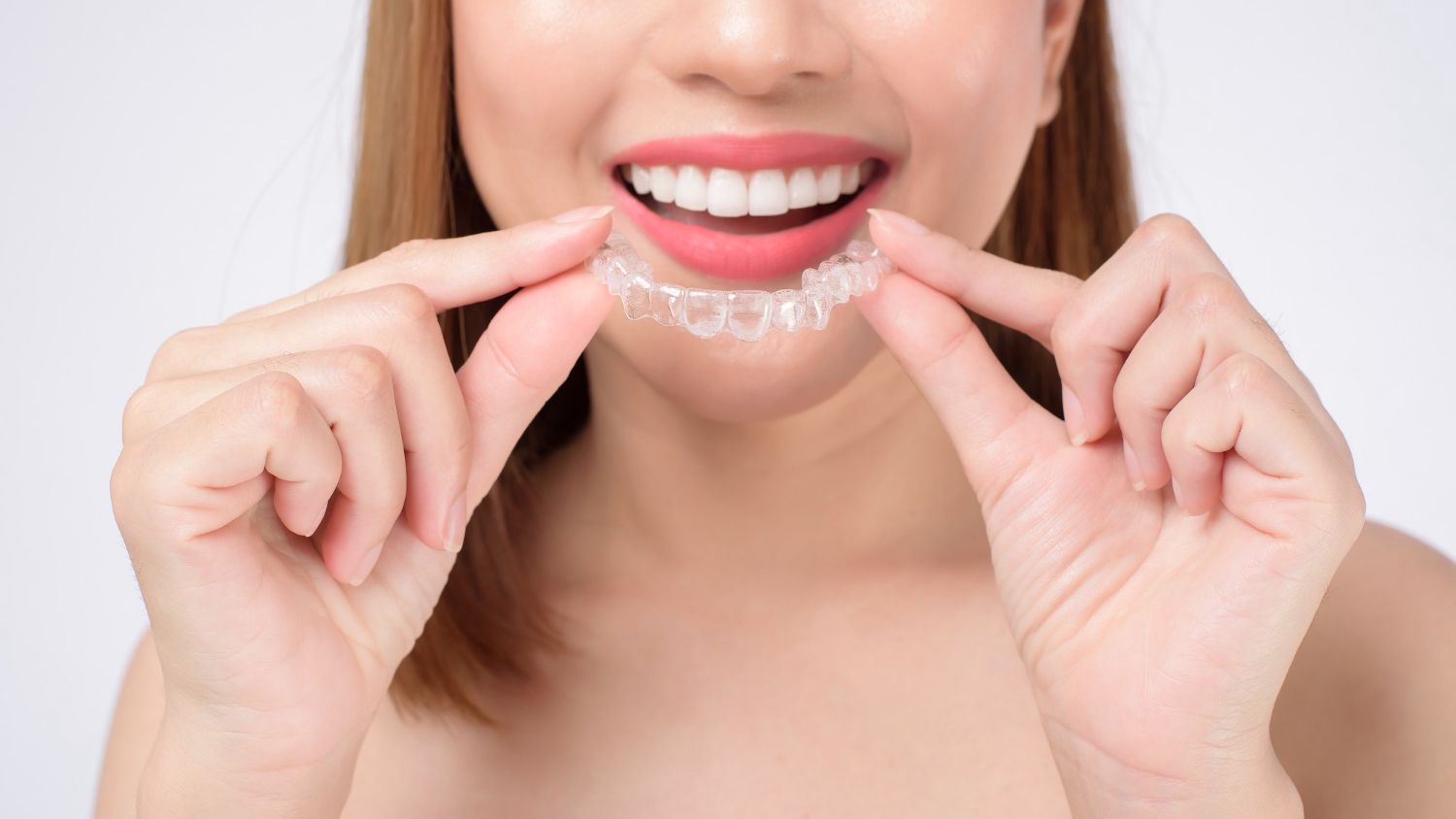 woman using invisalign