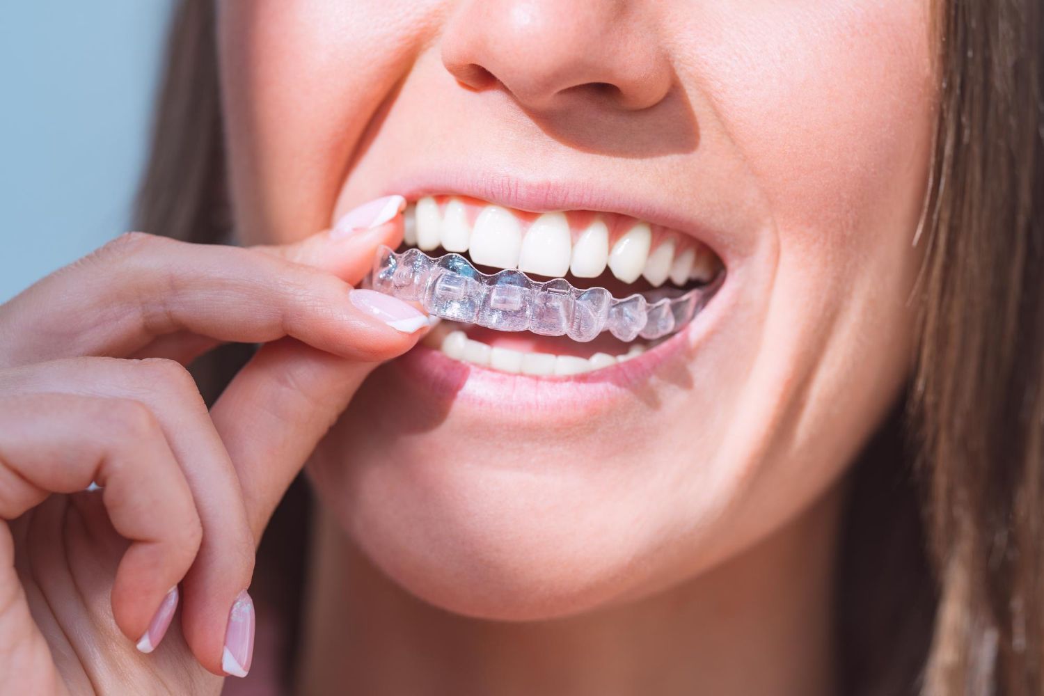 woman using invisalign