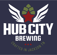 Hub City Brewing logo with white wings, hop, red star, and text on a navy blue background: "HUB CITY BREWING," "CRAFTED IN JACKSON TN."
