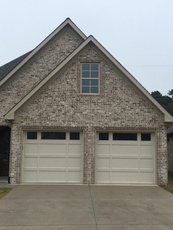 Home Exterior With Two Garage Door — Sherwood, AR — Harmon Overhead Door