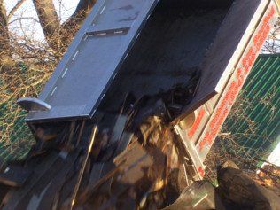 Unloading Roof Debris — Greenville, SC — Joe Roberson & Son Roofing