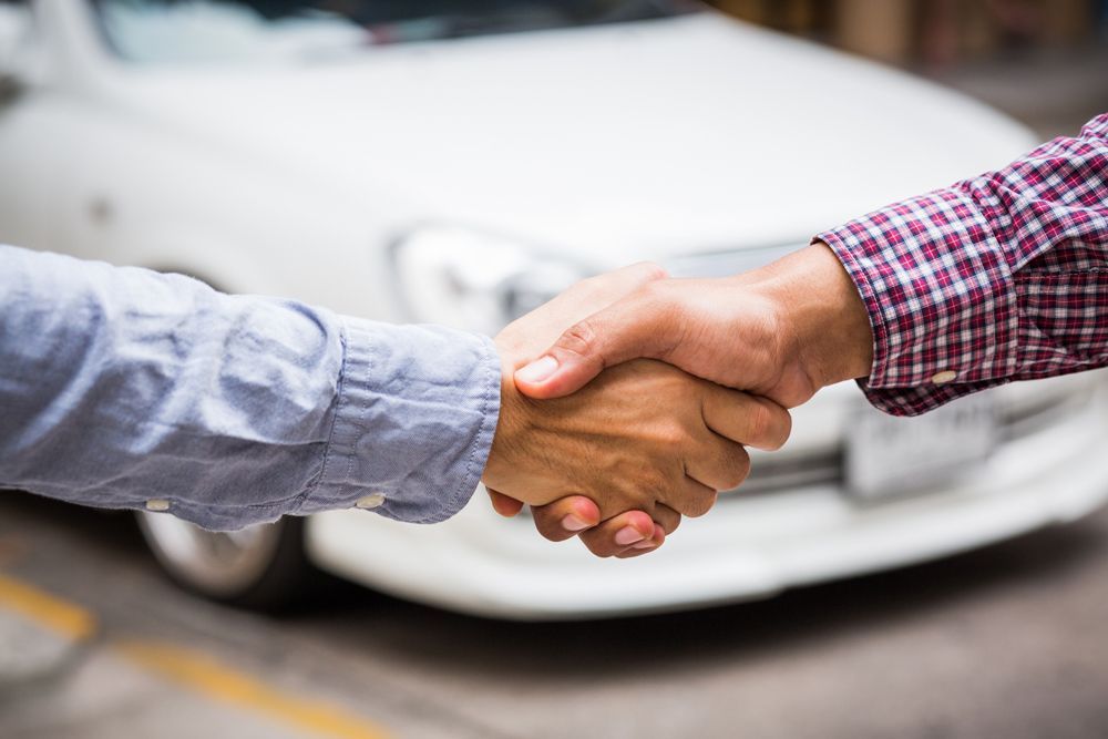 Handshake With Car Background — Ronceverte, WV — Square Deal Pre-Owned Cars & Trailer Sales