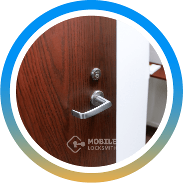 Sleek Silver Door Lever On Wooden Office Door.