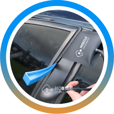 Auto Locksmith Safely Unlocks Car with Air Wedge And Plastic Crowbar Tool.