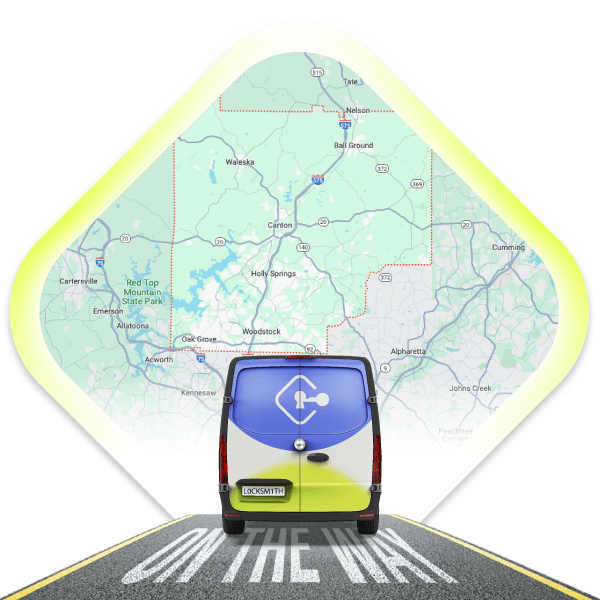 A Local Mobile Locksmith Van Is Driving On A Road With A Map Of Cherokee County, Georgia, In The Background.