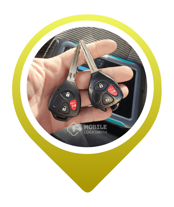 A Close-Up Of A Car Locksmith's Hand Holding A Transponder Key.