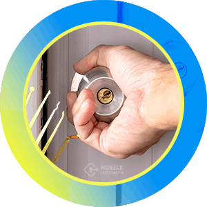 Close-Up Of Locksmith's Hand Opening A Doorknob Lock.