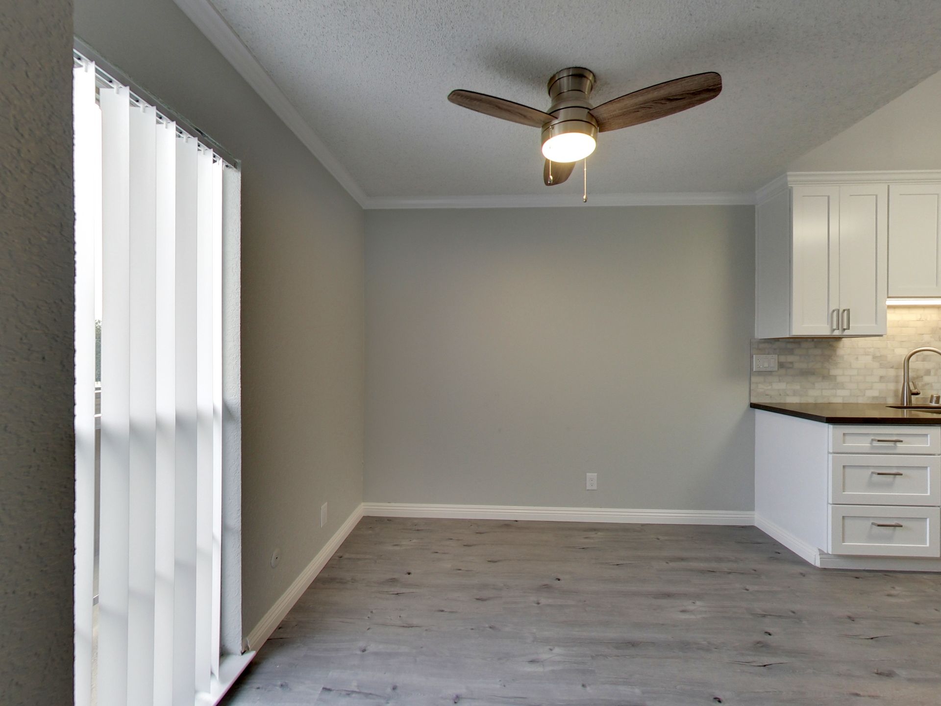 Photo of empty room with ceiling fan