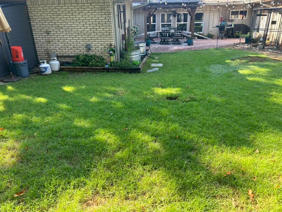 A Backyard with A Lot of Grass and A Brick Building in The Background - Collinsville, TX - L5 Irrigation