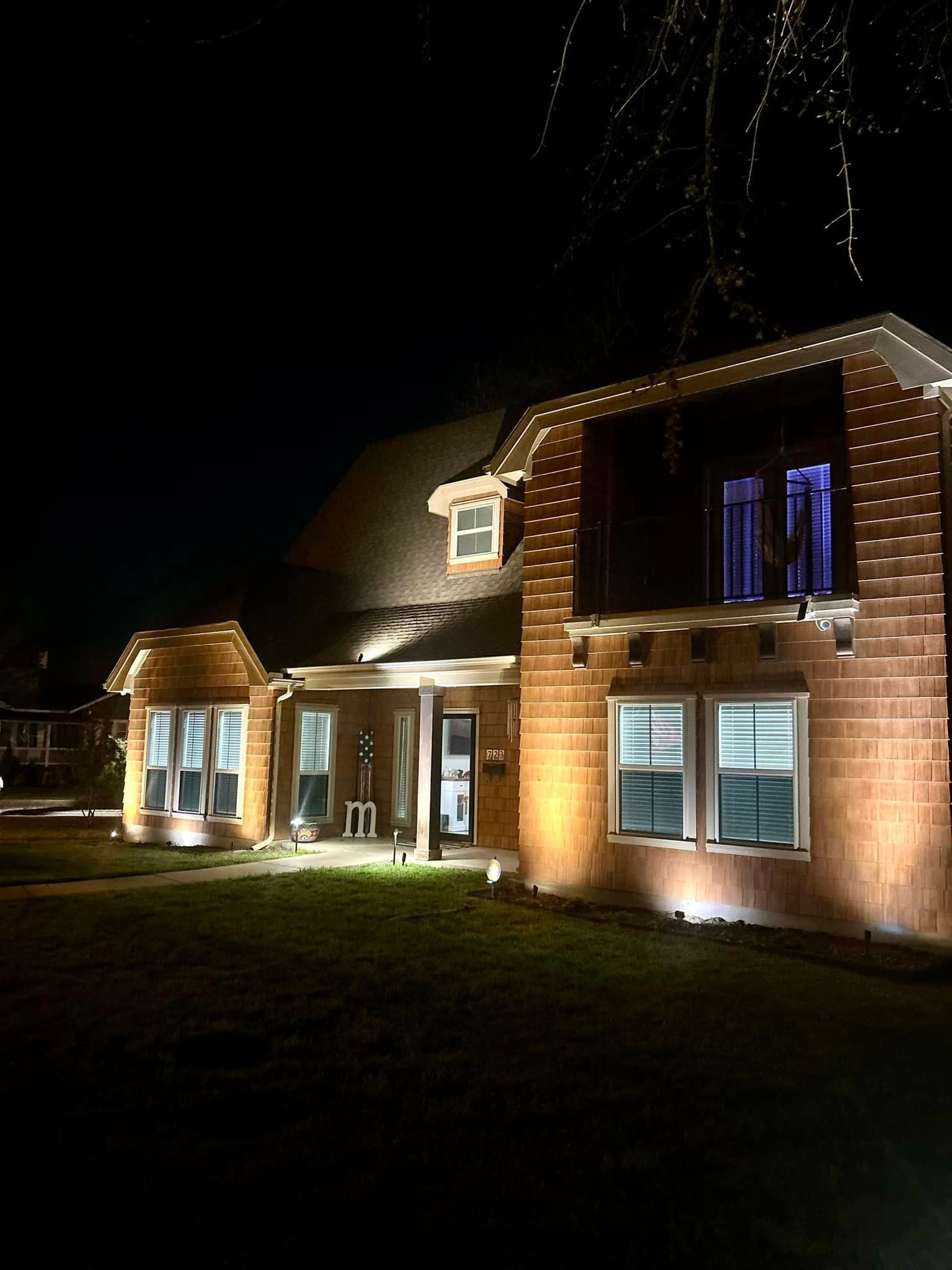 A Garage with Two Doors Is Lit up At Night - Collinsville, TX - L5 Irrigation