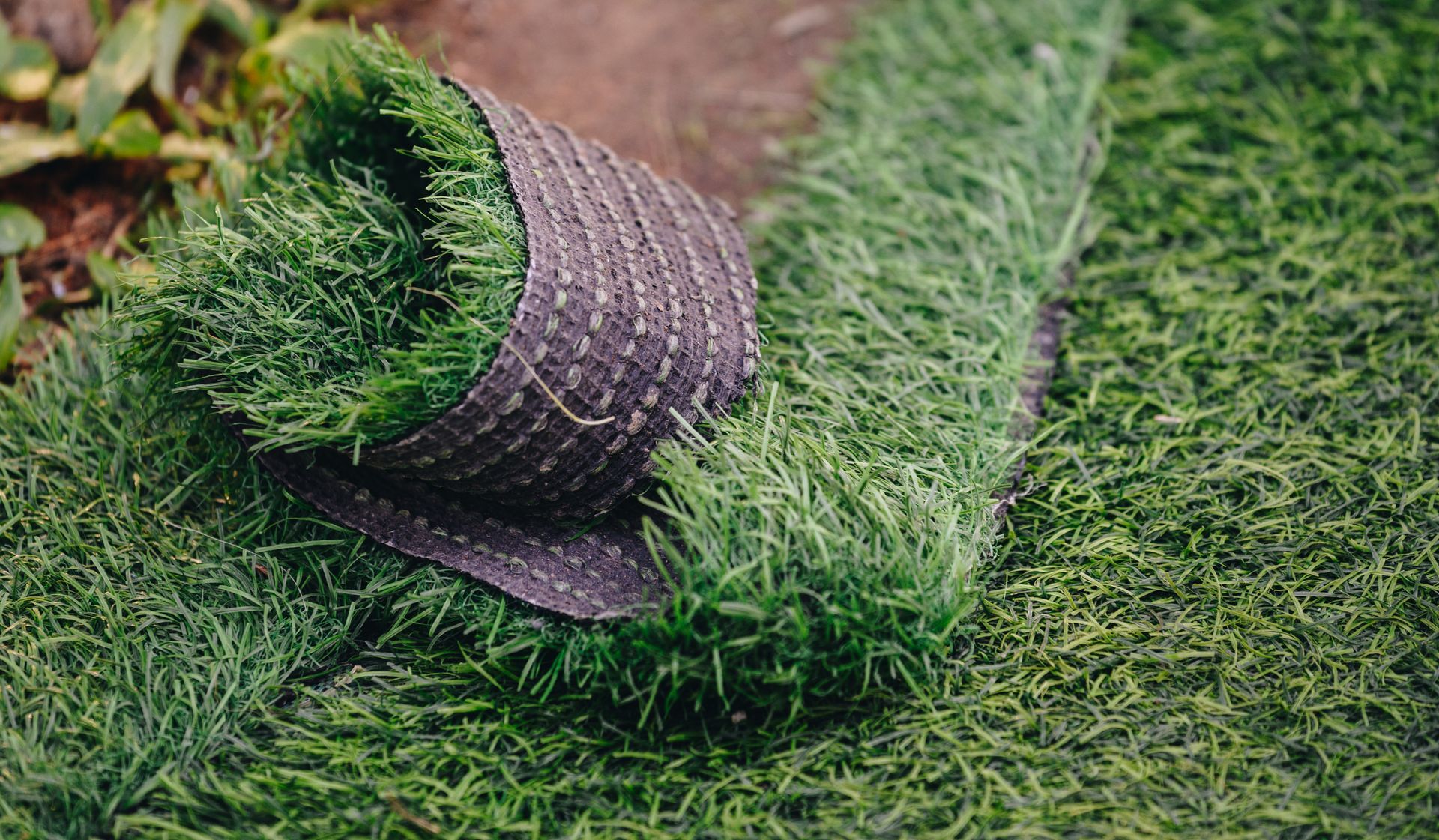Close up of green artificial turf used for covering sport arena or garden- Collinsville, TX - L5 Irrigation