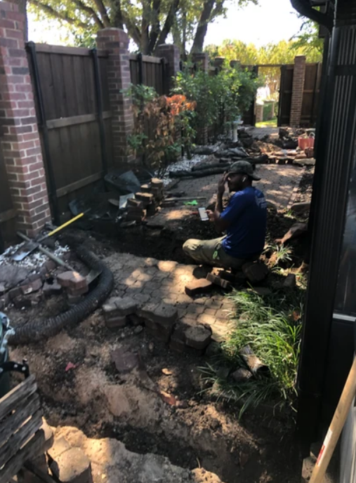 A Man is Sitting on a Rock - Collinsville, TX - L5 Irrigation