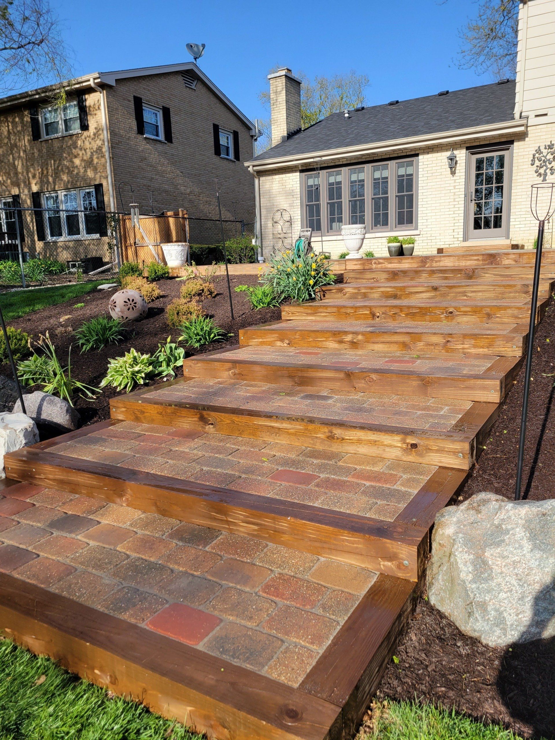 A set of wooden stairs leading up to a house.