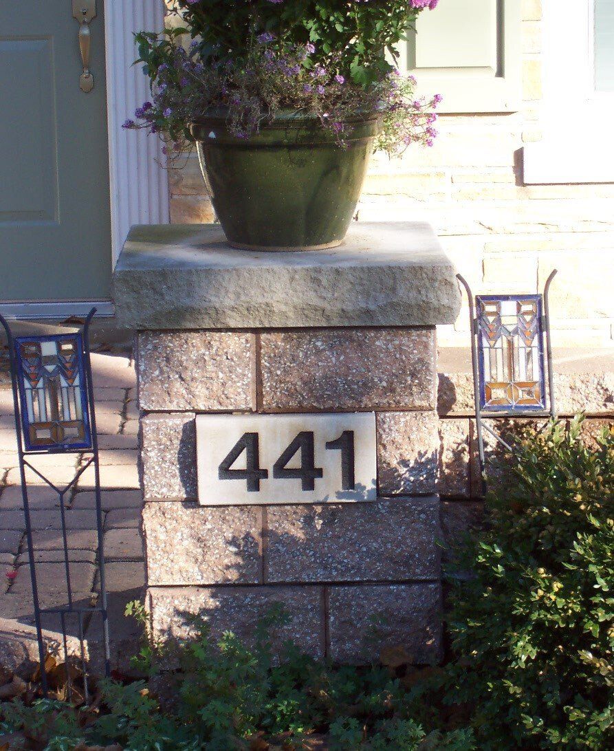 A brick wall with the number 441 on it