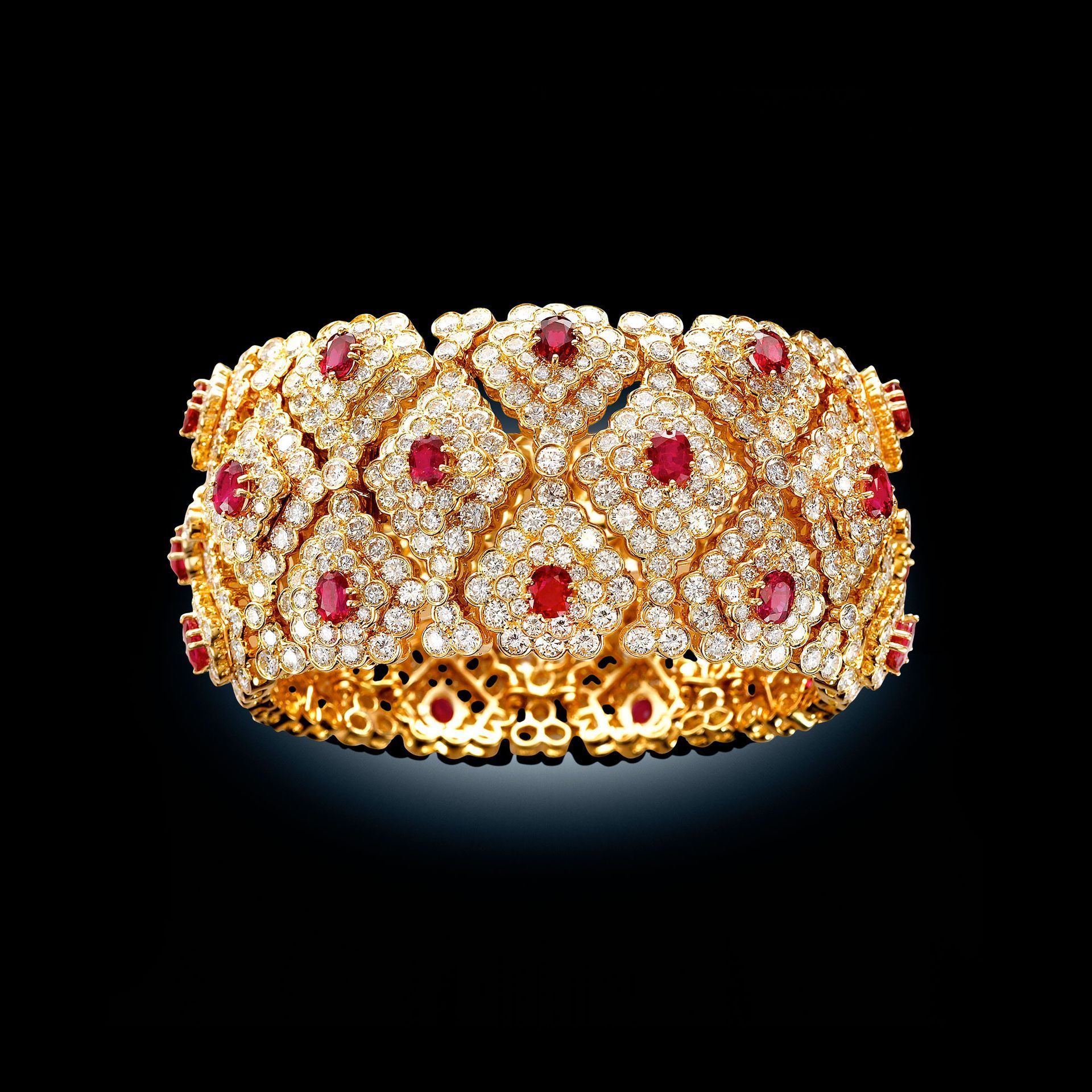 A ring with emeralds and diamonds on a cloth