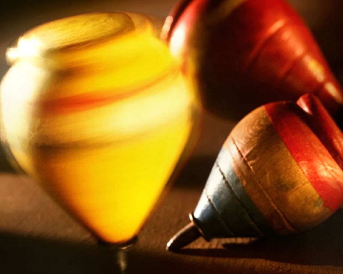 A black and white photo of a foggy field with trees in the background.