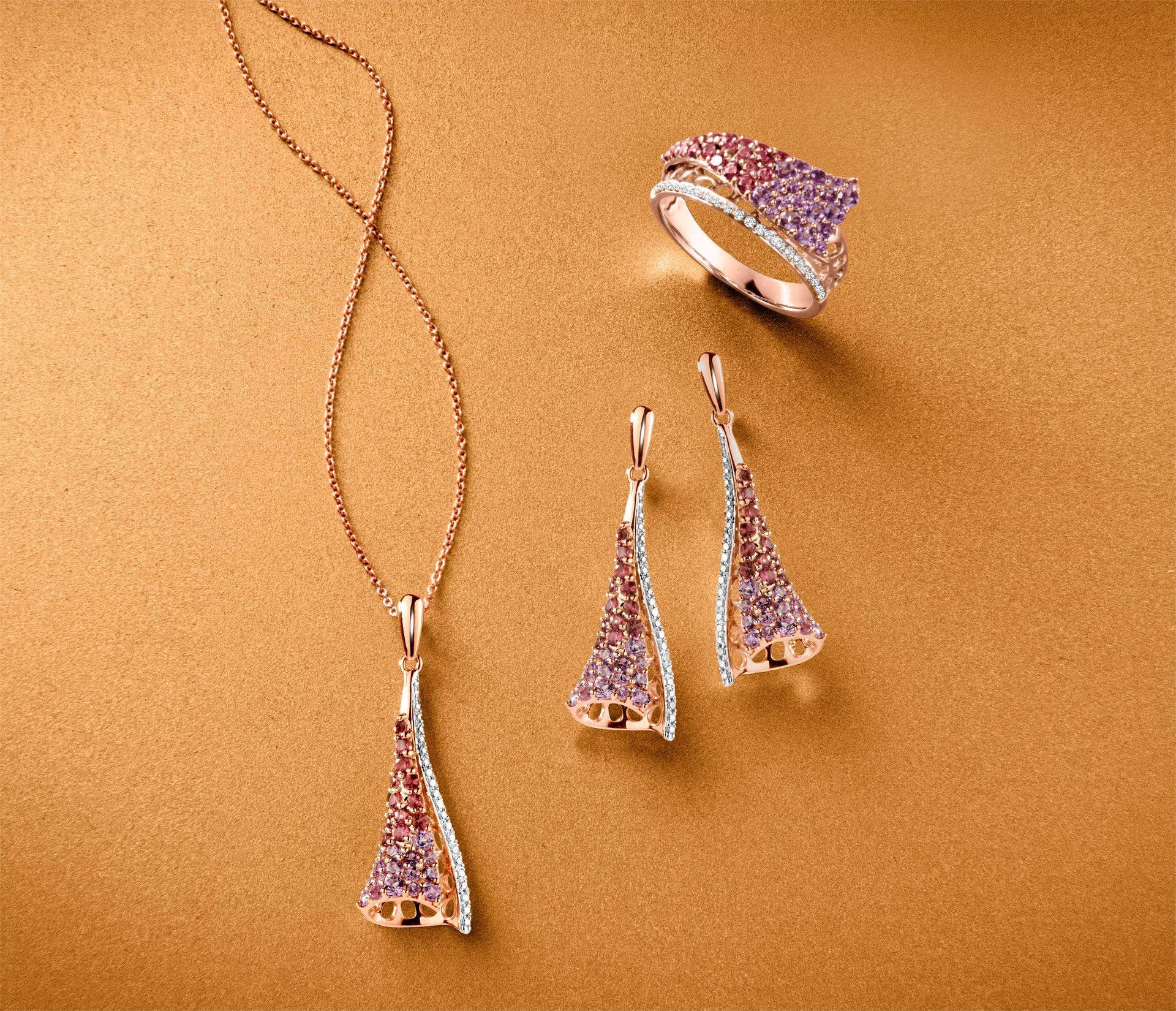 A bunch of gold jewelry on a white egg