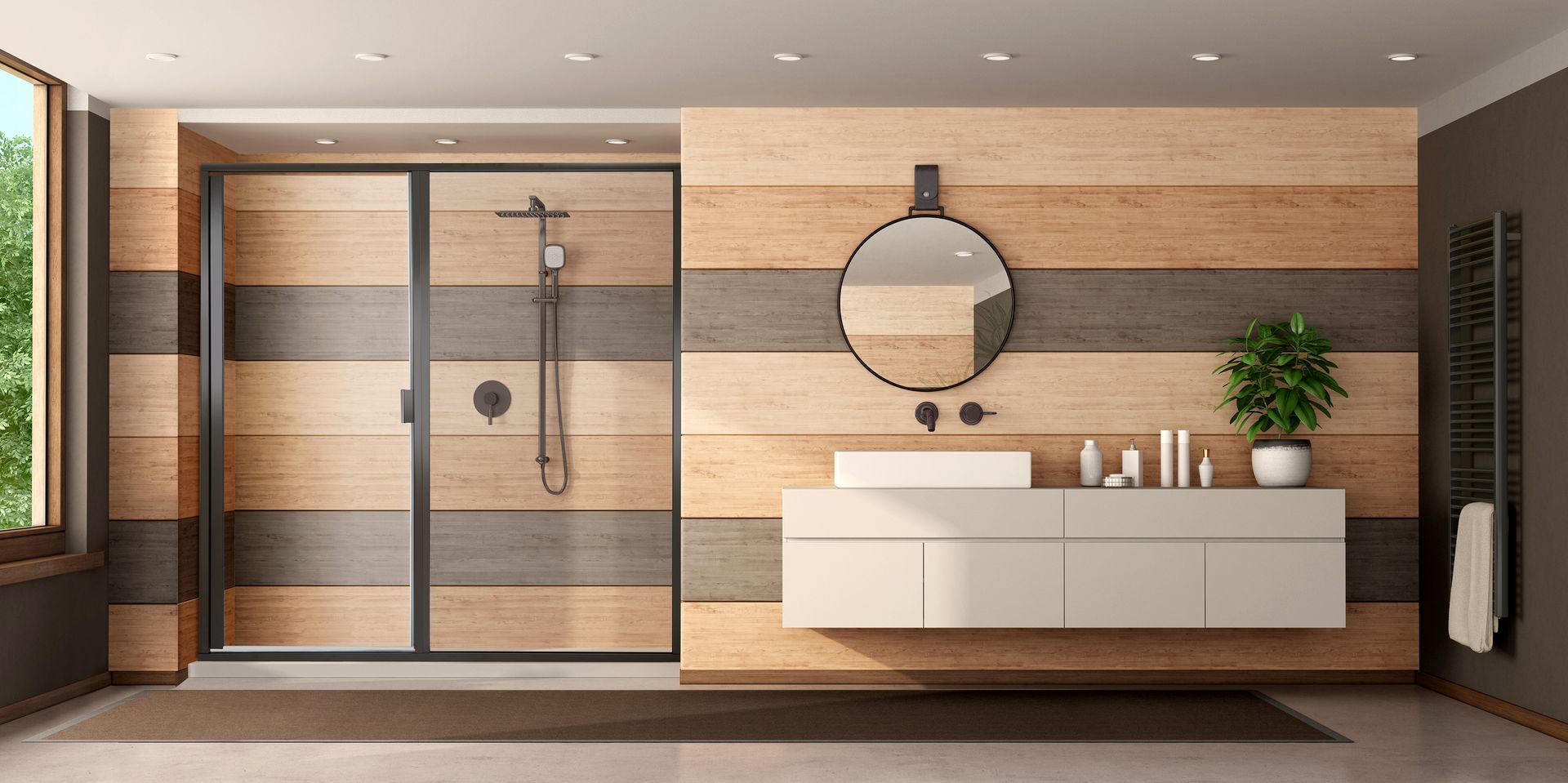 Modern bathroom with wood-paneled walls, glass shower, floating vanity, round mirror, and potted plant.
