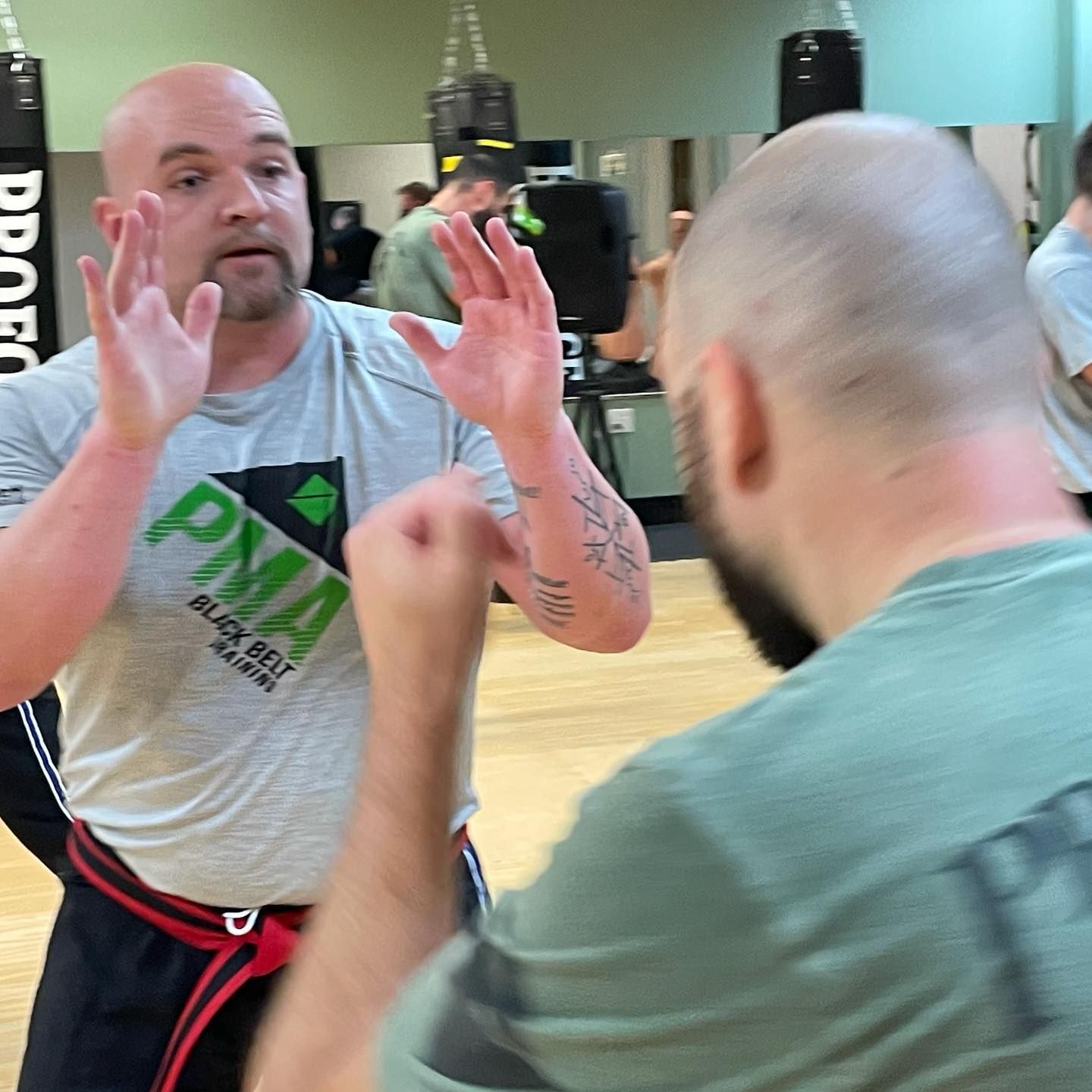 A man wearing a shirt that says pma on it