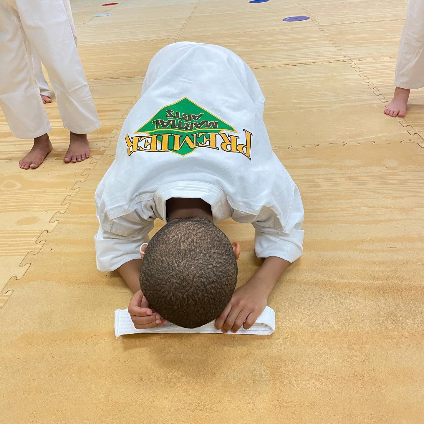 a young child bowing