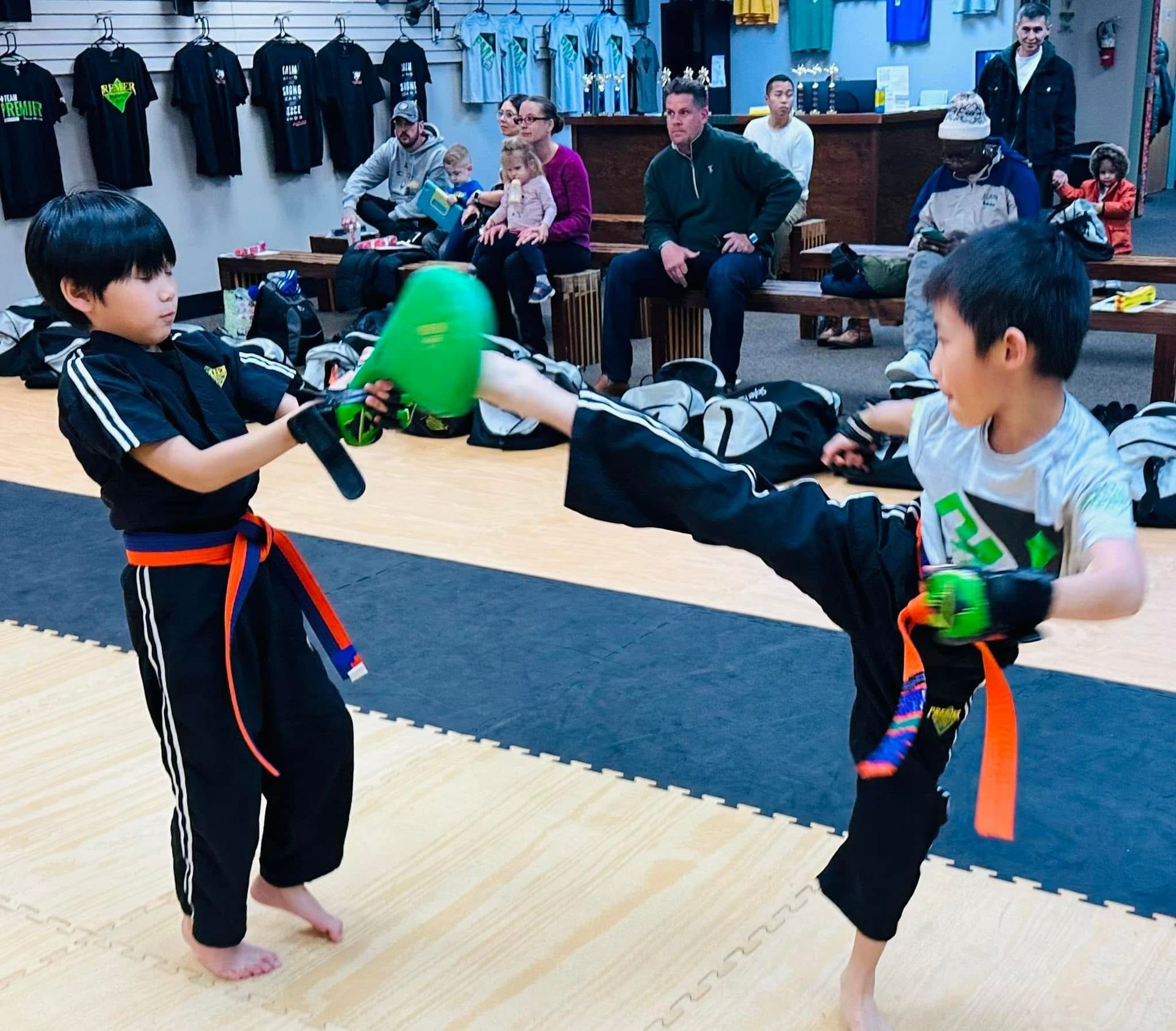 instructor teaching girl how to kick