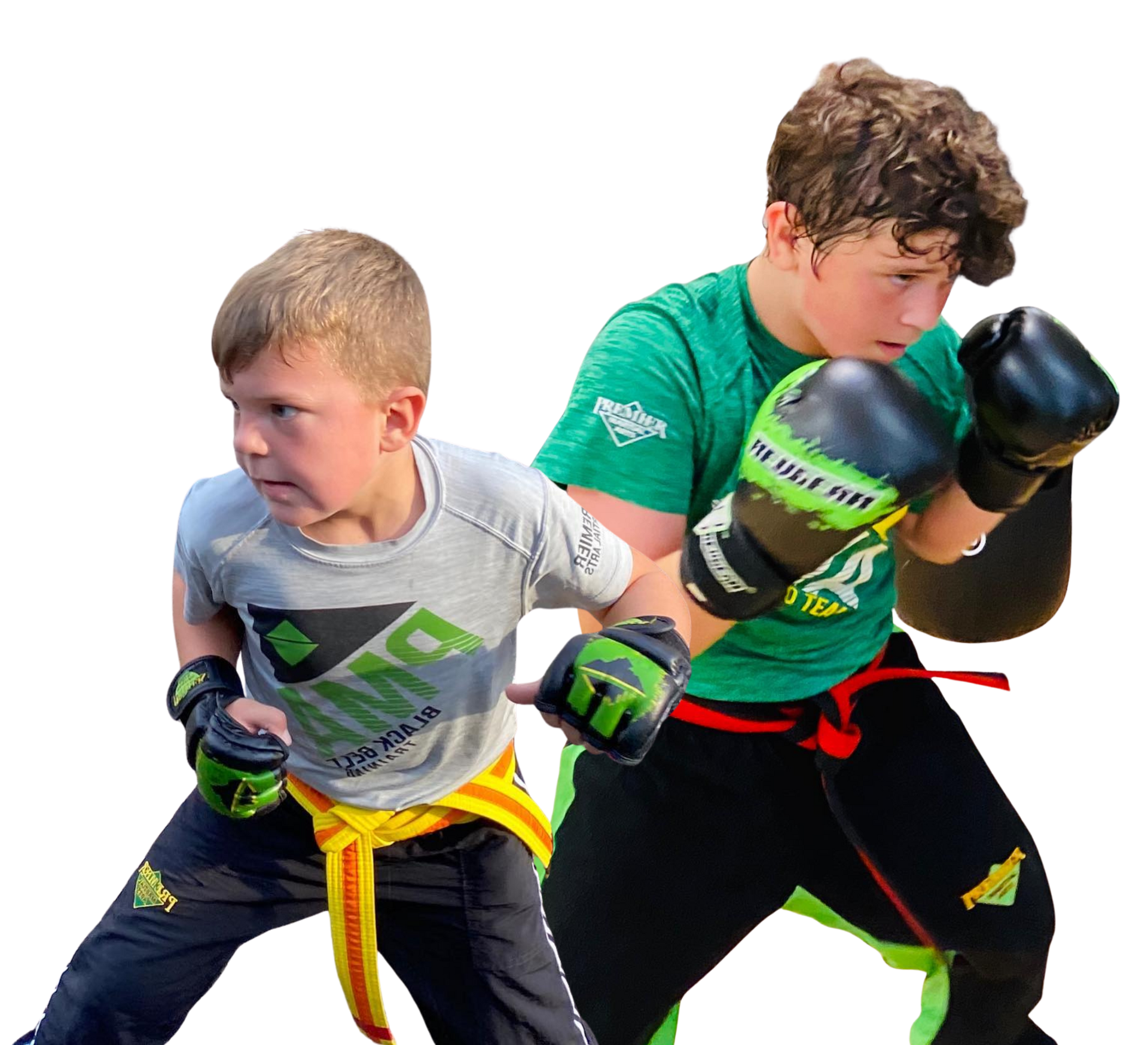 A group of kids in karate uniforms are sitting on the floor drinking water