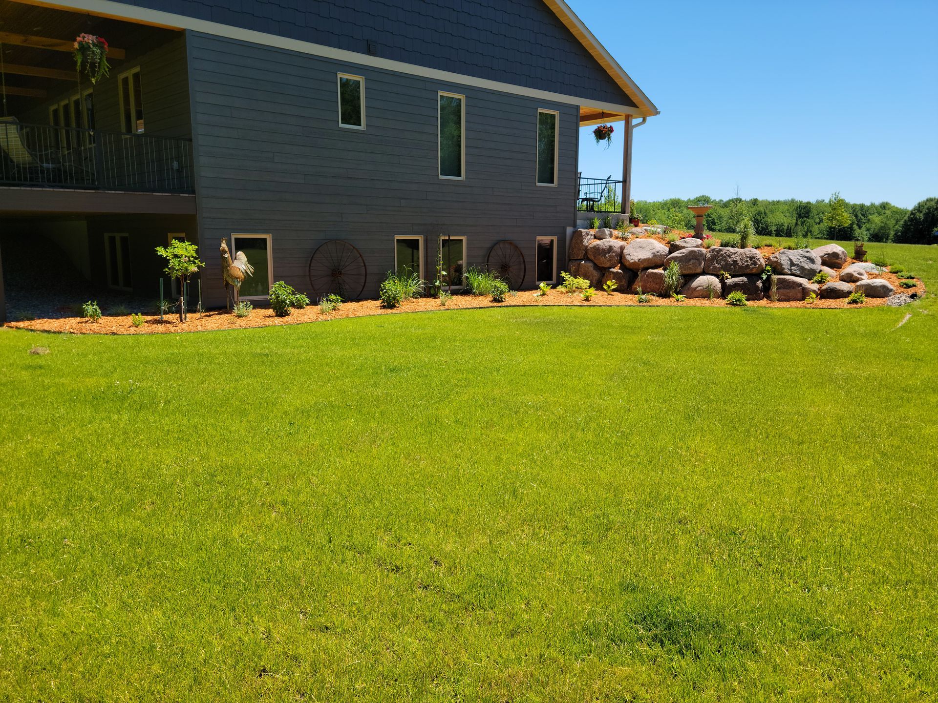 A house with a large lawn in front of it
