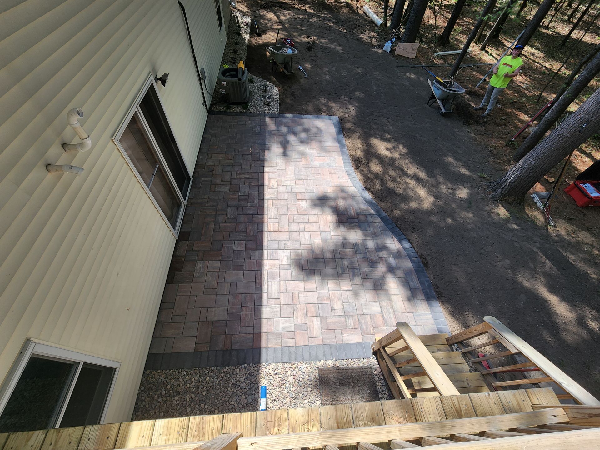 An overhead view of a house with a new brick patio and stairs installed in Rothschild, Wisconsin