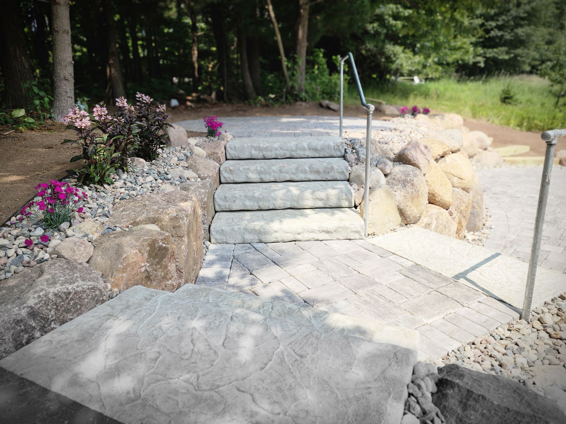 A set of stairs leading up to a rock wall