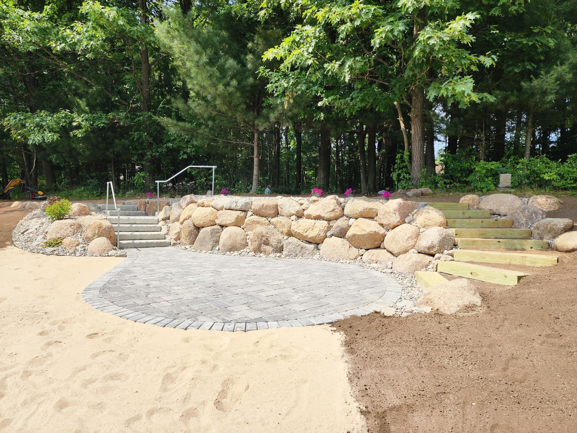 A stone wall with stairs leading up to it