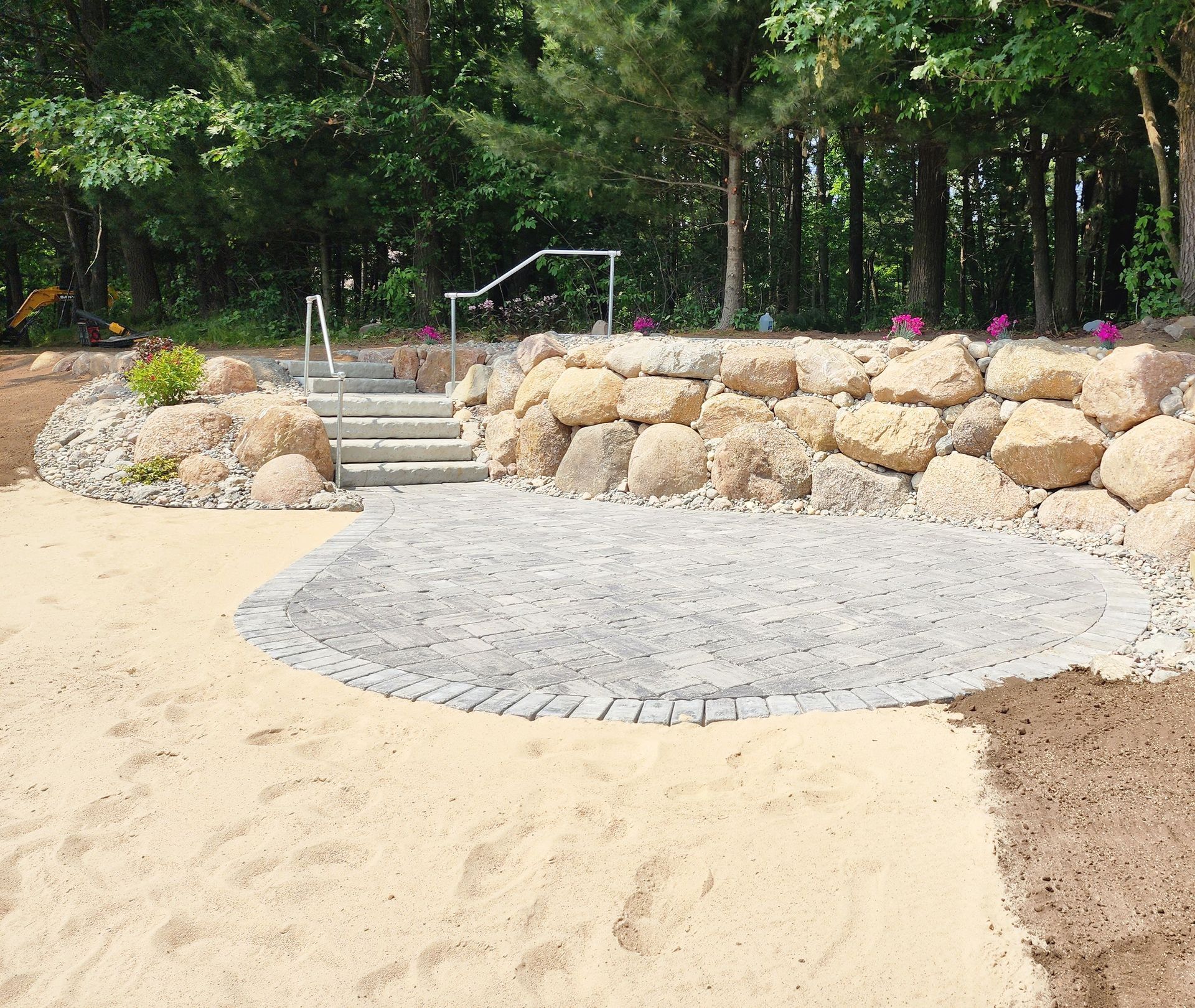A stone wall with stairs leading up to it