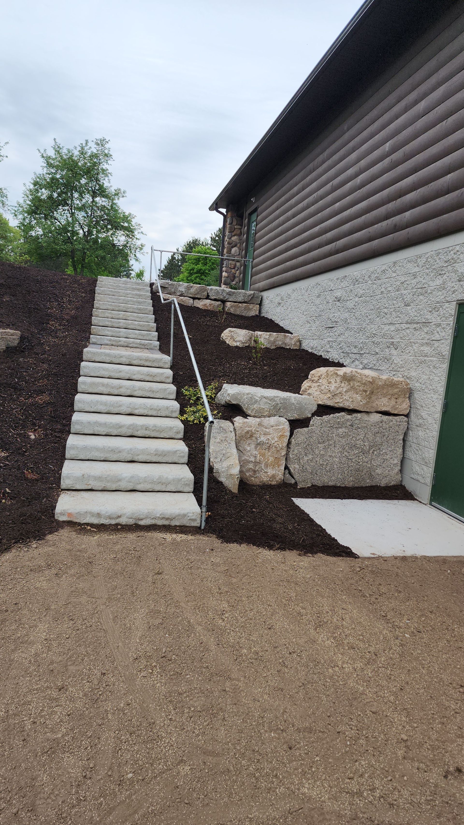A set of stairs leading up to a house.
