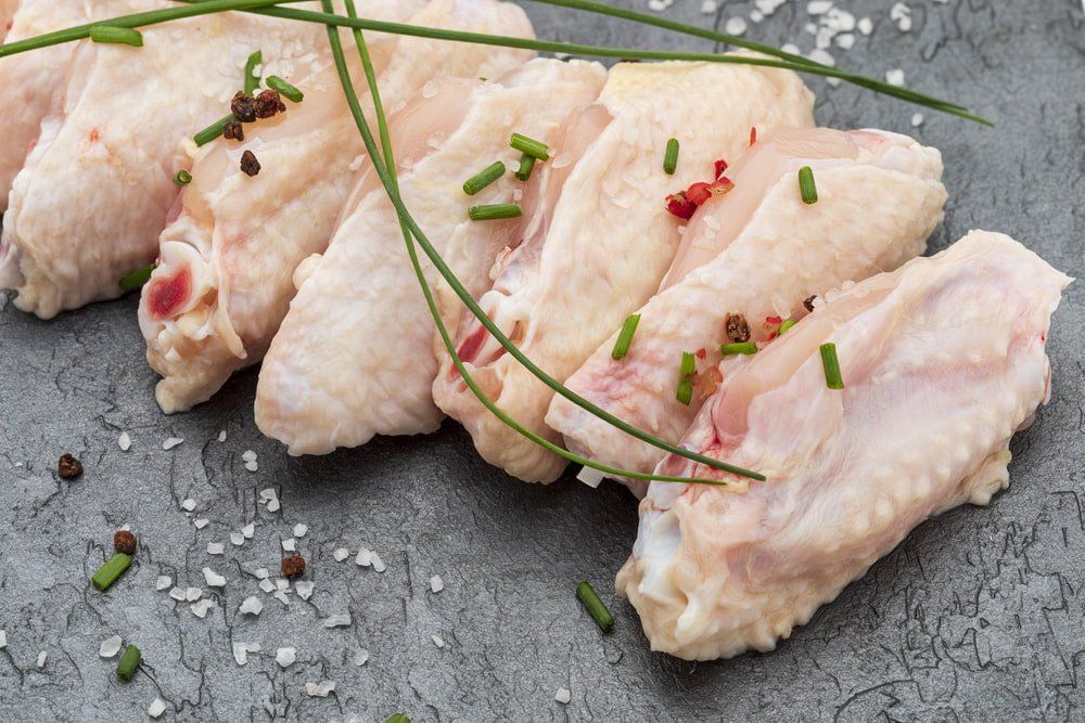 Raw Chicken Wings Marinated With Salt, Pepper & Chives — Butcher in Wauchope, NSW