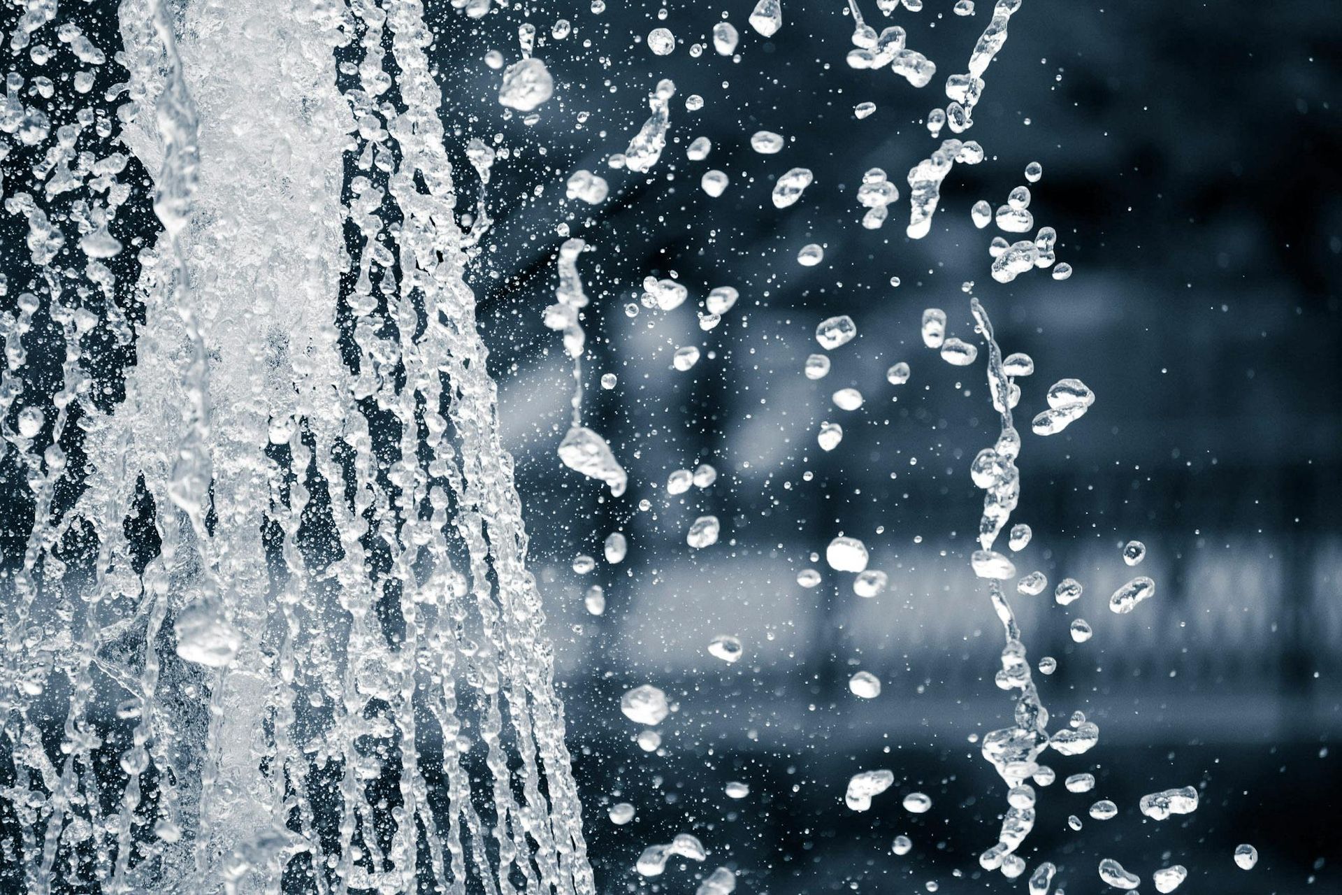 A close up of a water fountain with bubbles coming out of it