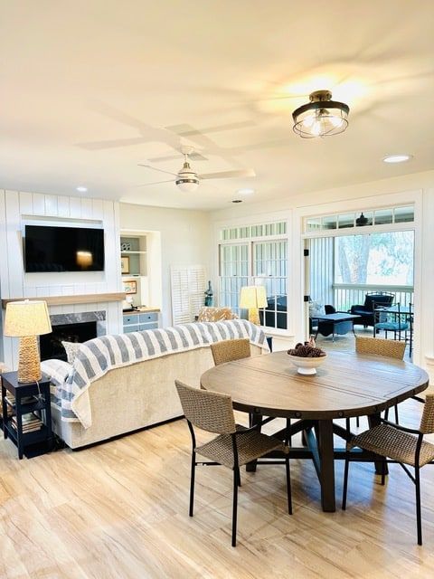A living room with a round table and chairs