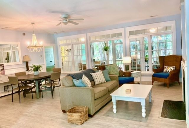 A living room with a couch a table and chairs