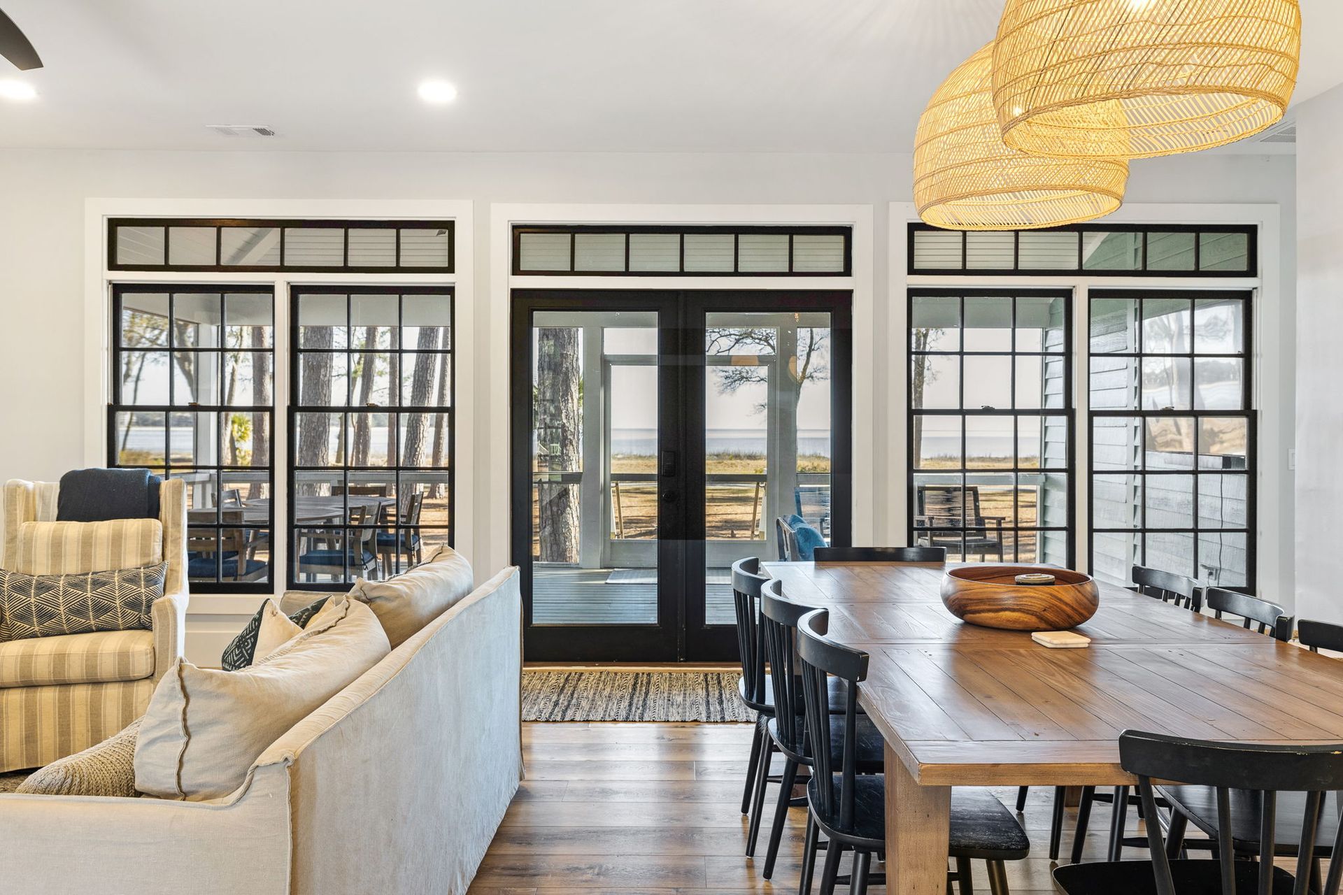 A living room with a dining table and chairs and a couch.