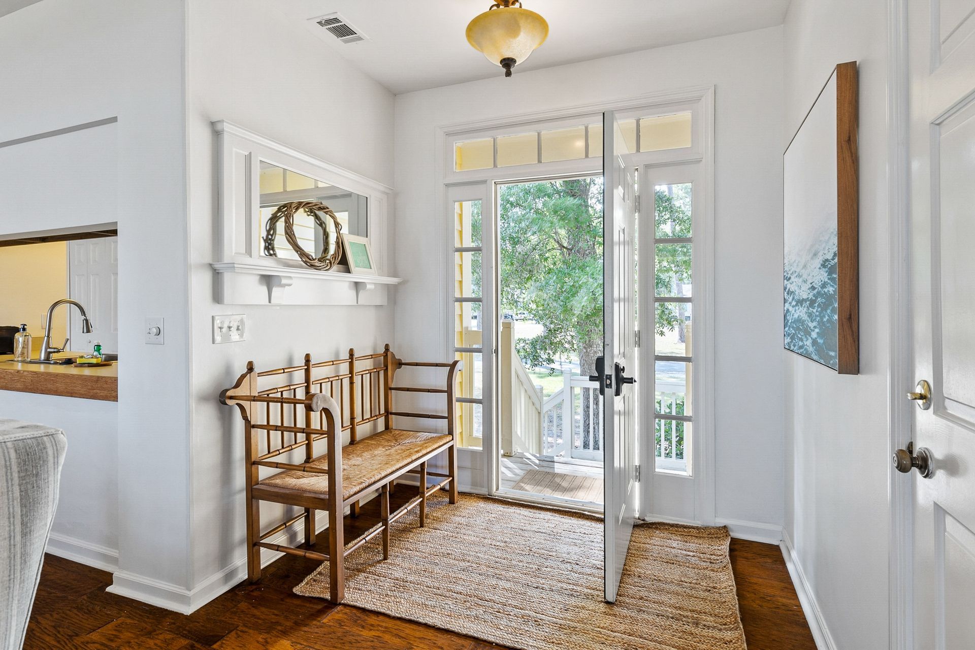 A living room with a dining table and chairs and a couch.