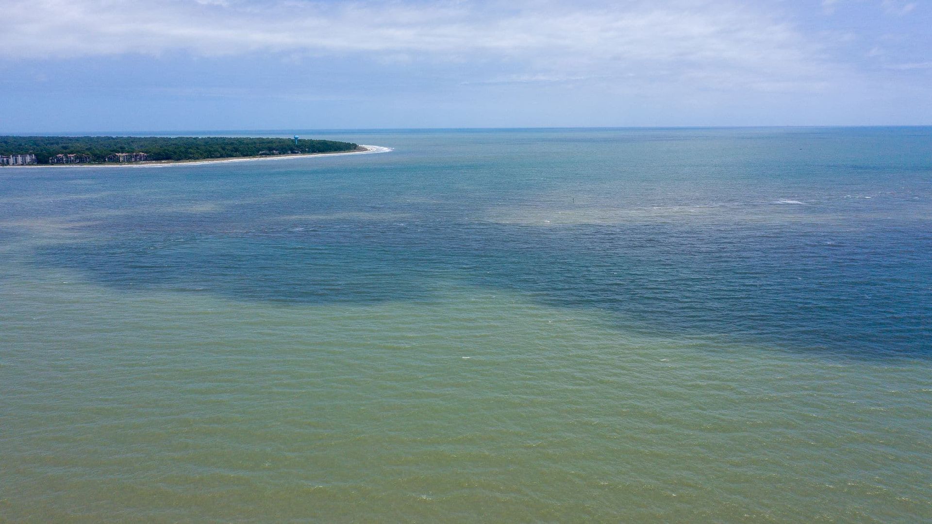 There is a small island in the middle of the ocean.