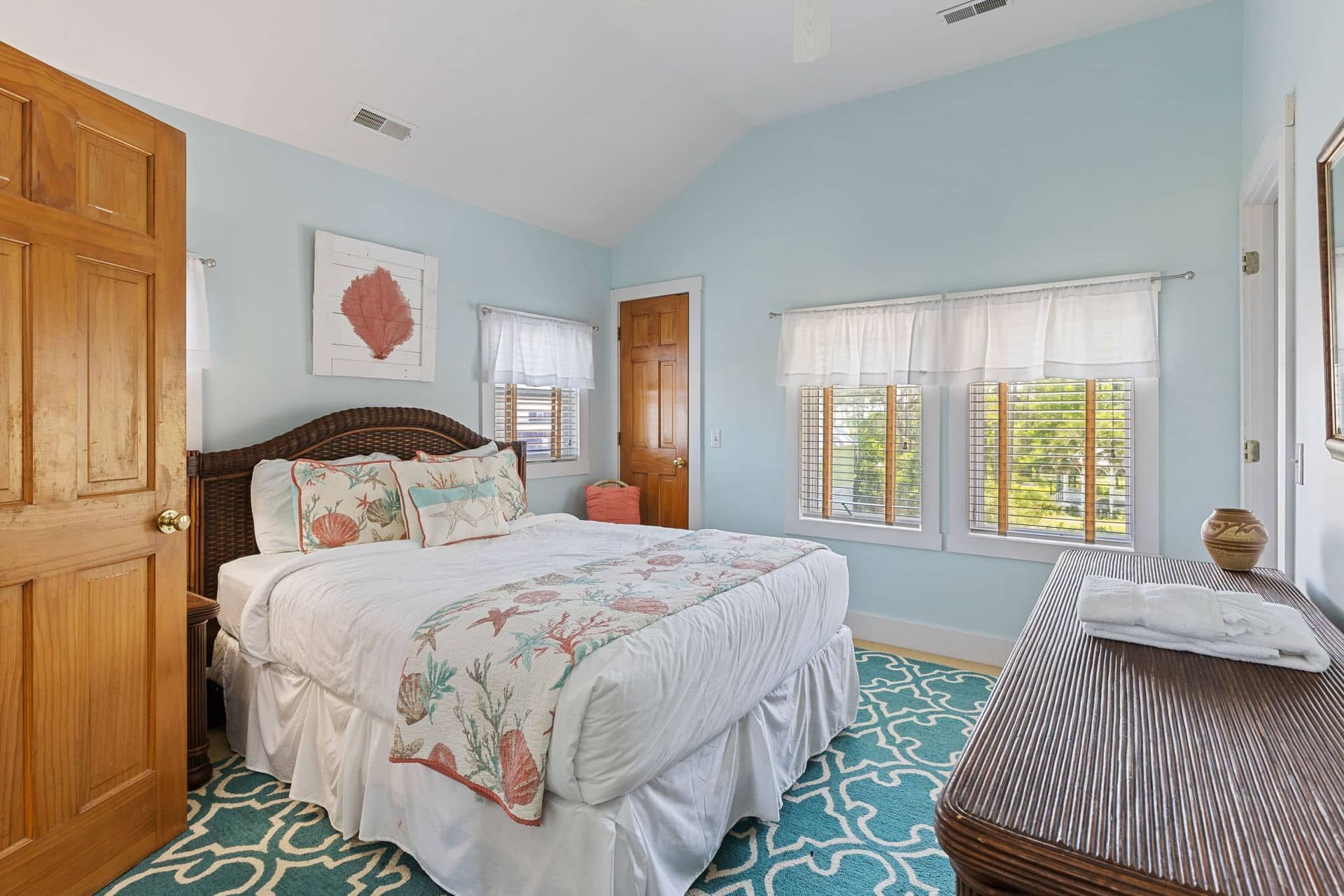 There is a large bed in the middle of the room.