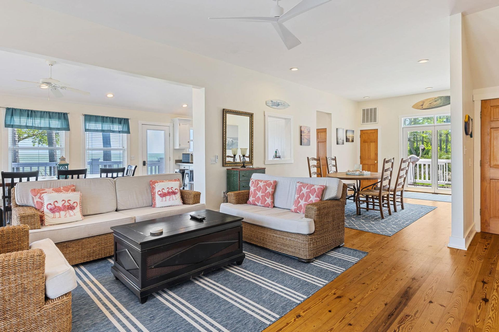 A living room filled with furniture and a ceiling fan