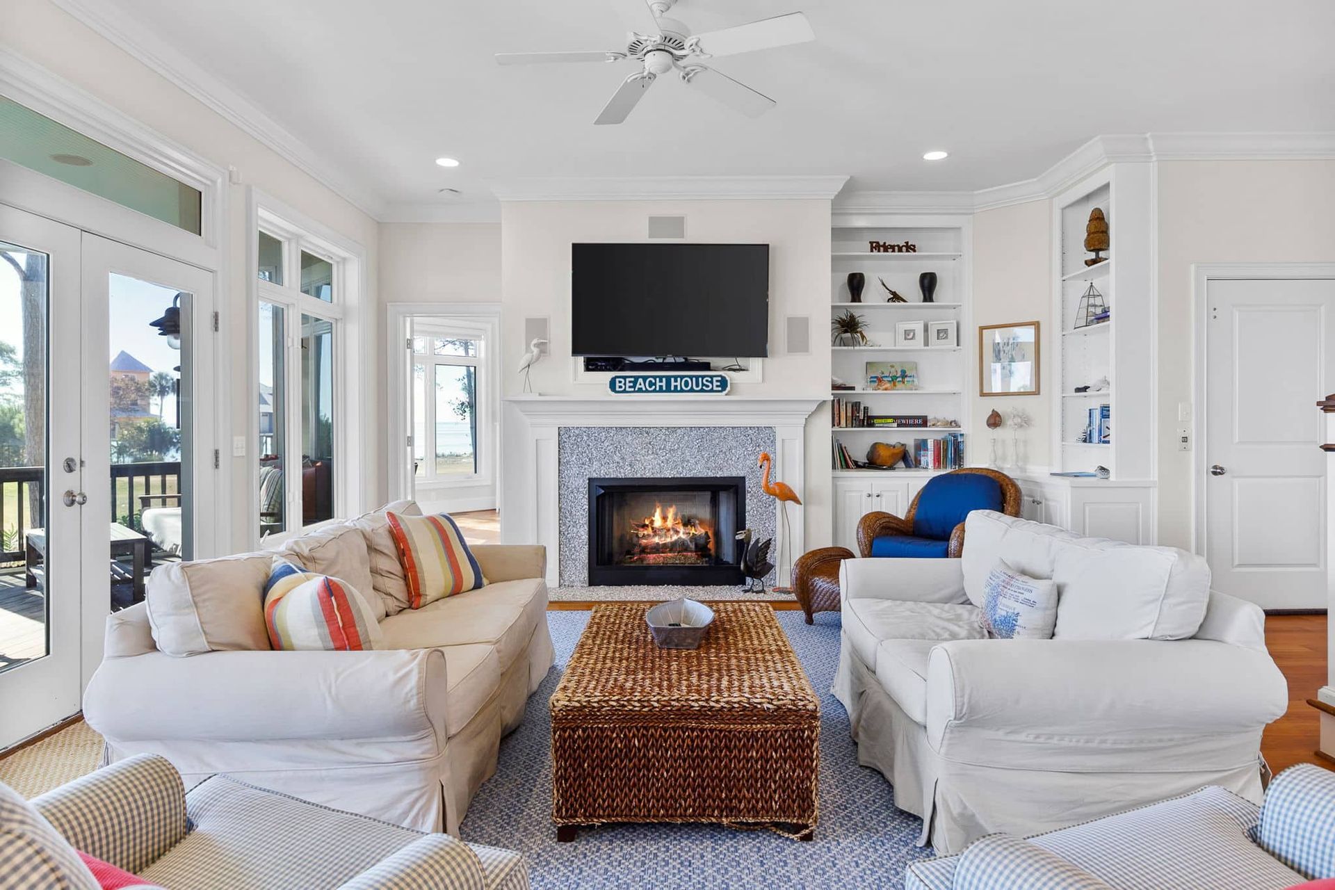 A living room filled with furniture and a fireplace.