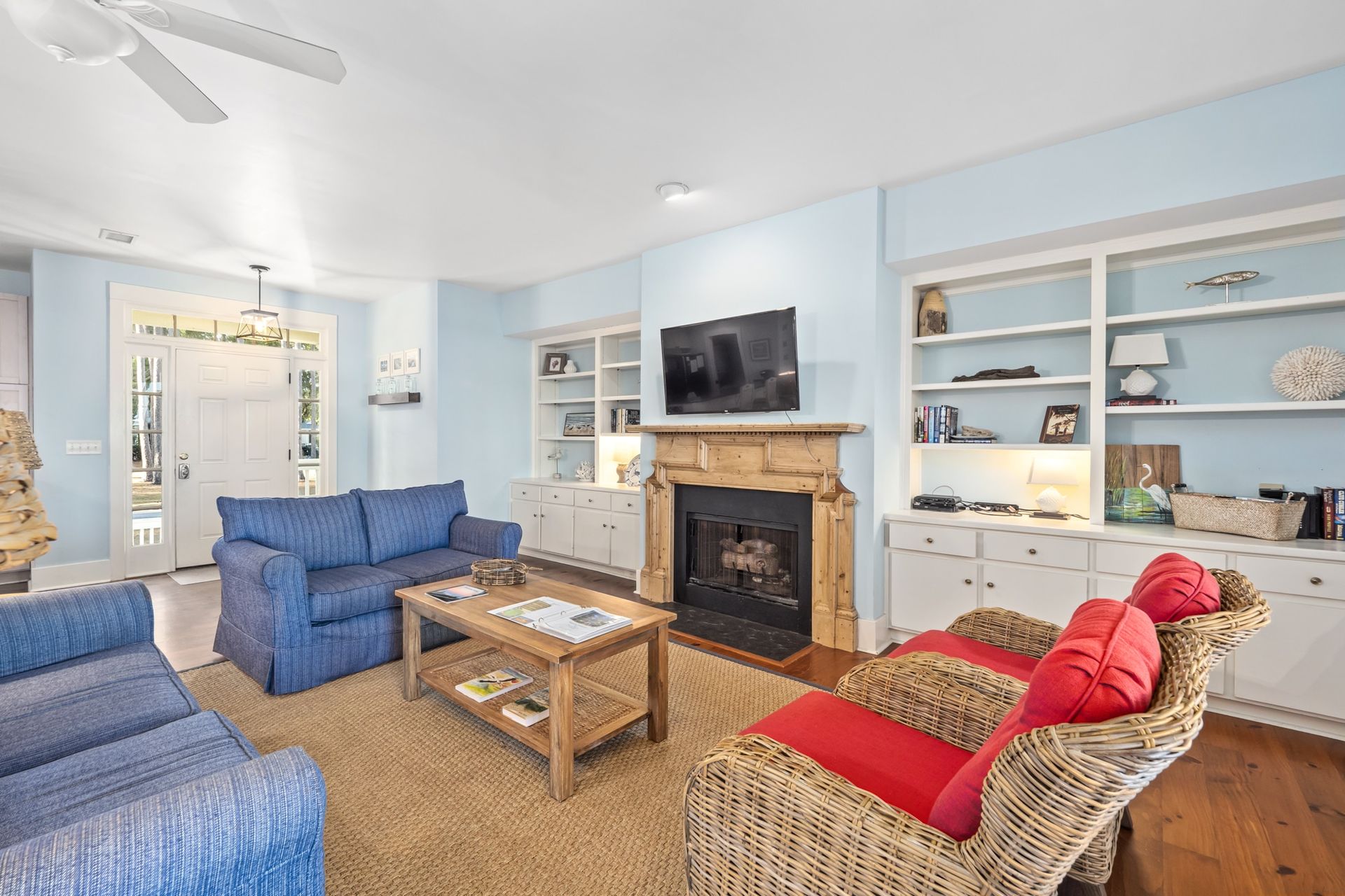 A living room filled with furniture and a fireplace.