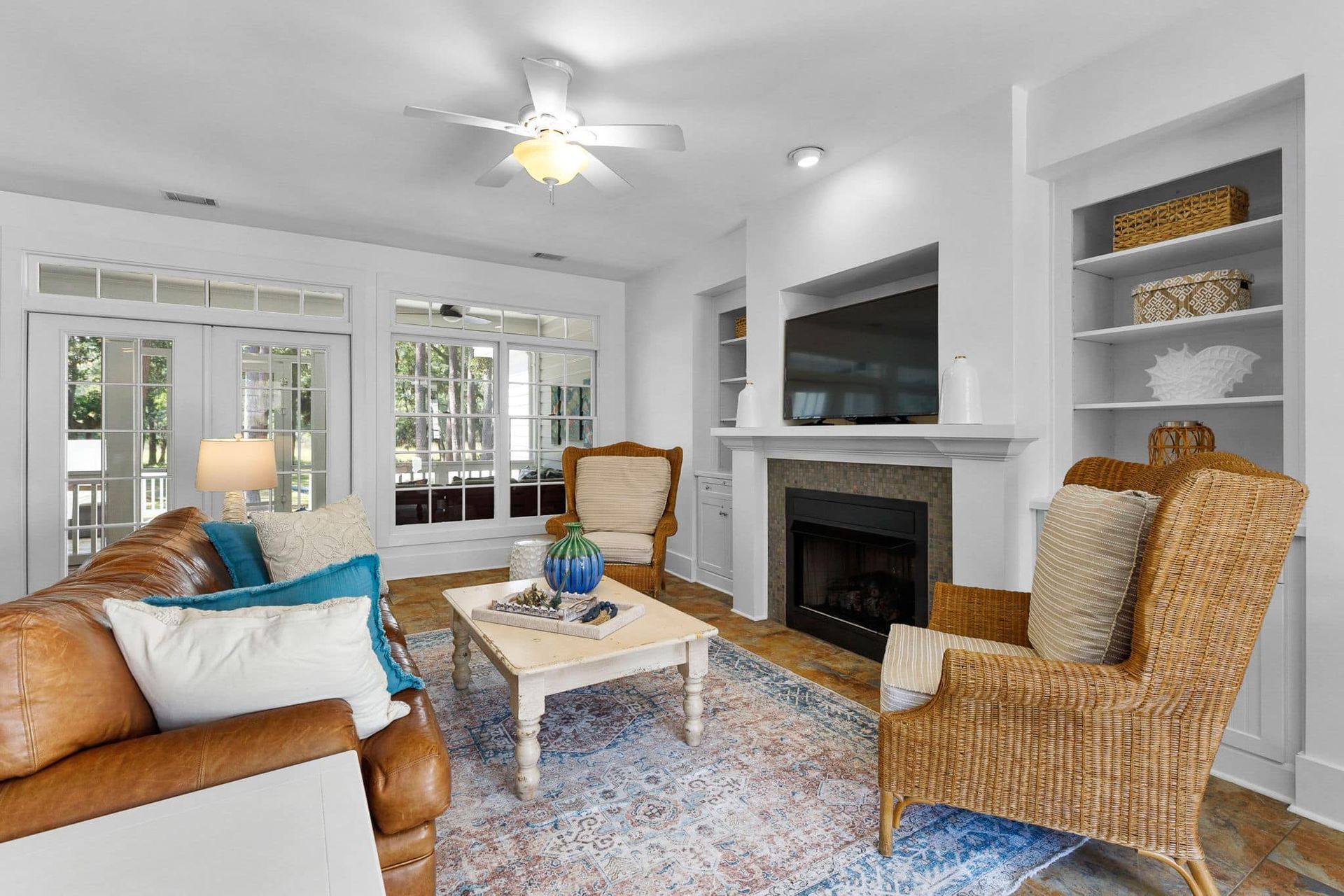 A living room filled with furniture and a fireplace.