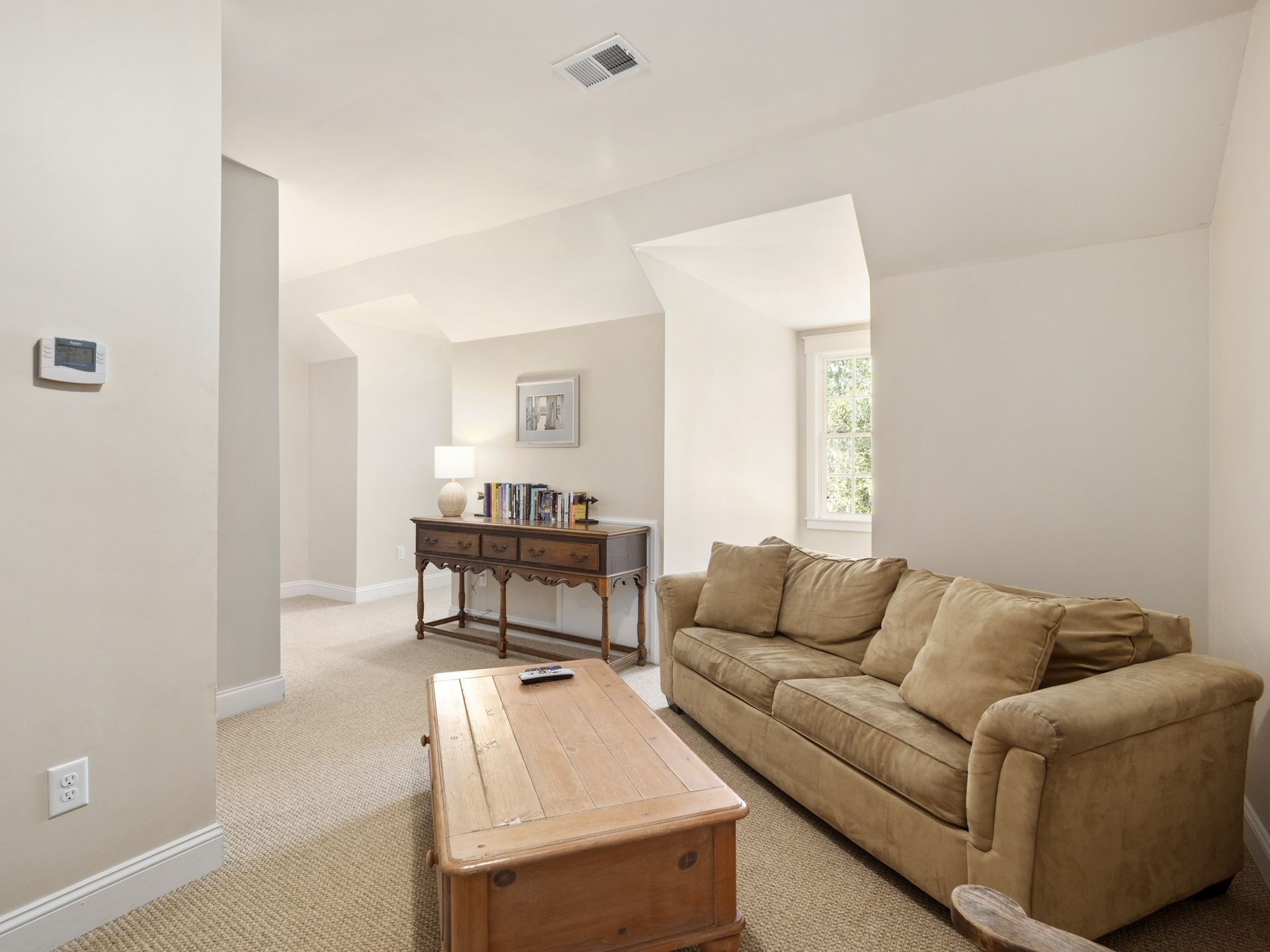 A living room with a couch and a coffee table