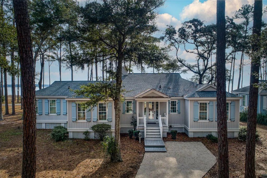 An aerial view of a house surrounded by trees.