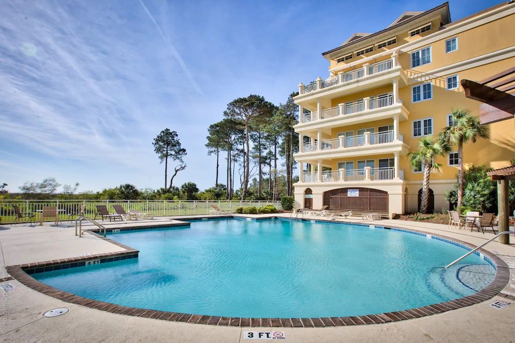 A large swimming pool in front of a large building